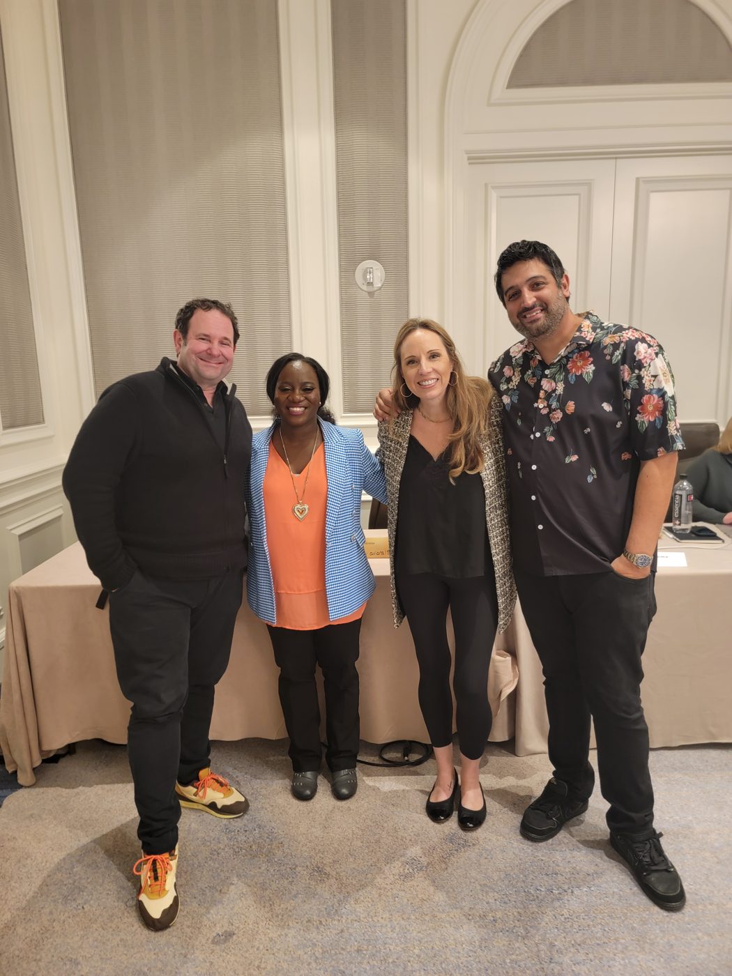 Esther Q Tsedey with her mergers and acquisitions mentors, including Roland Frasier and DeAnna Rogers