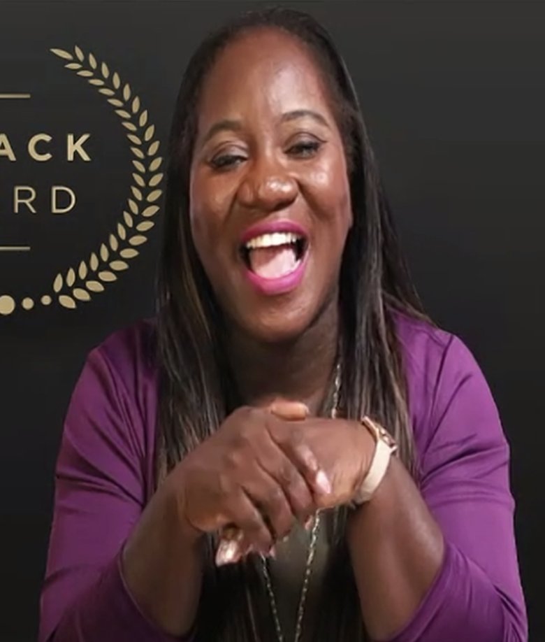 Esther Tsedey delivering a virtual keynote at the Black Card event