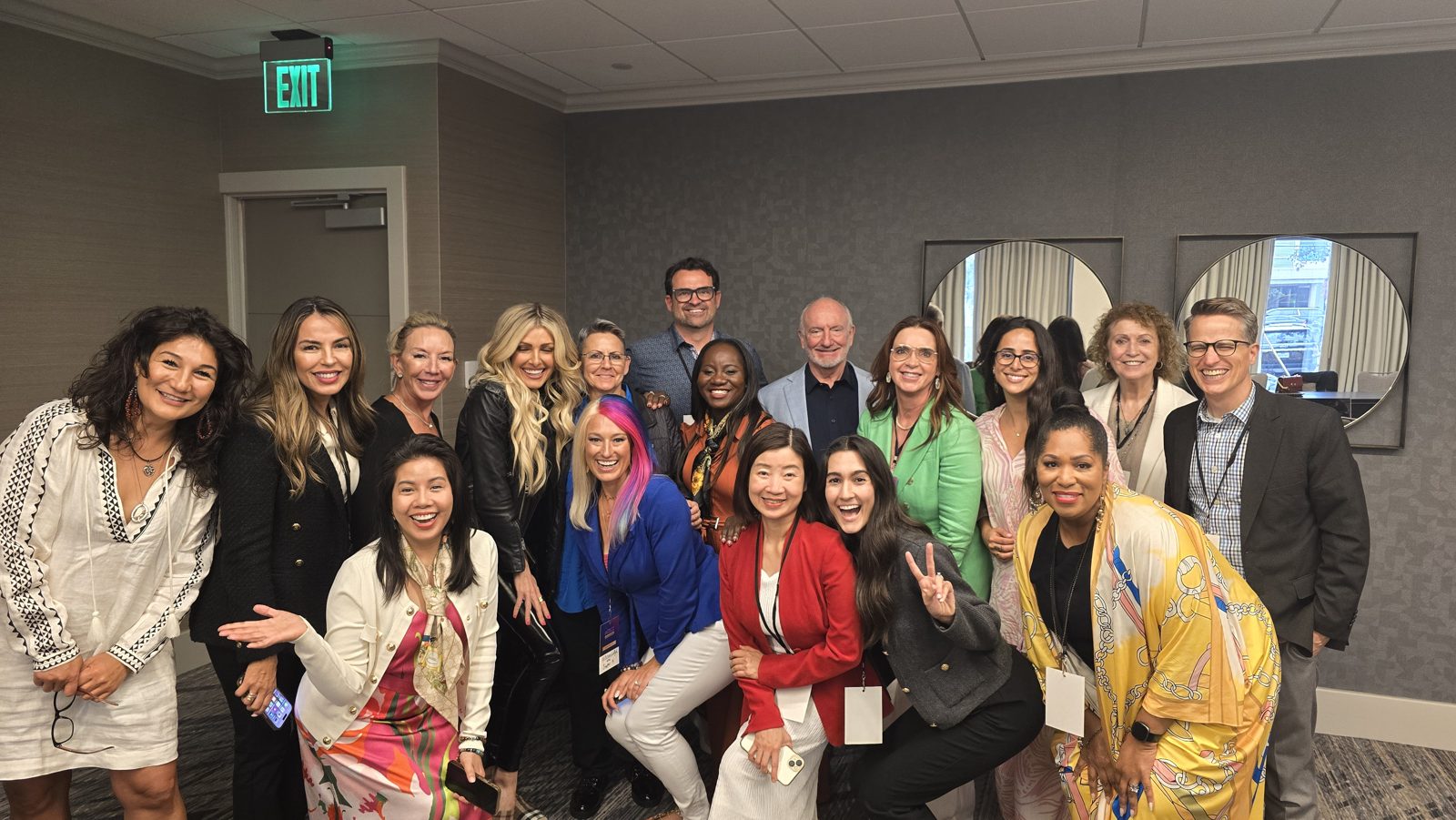 Esther Tsedey with guests after her first keynote on stage at Eileen Wilder's live event in Houston, Texas