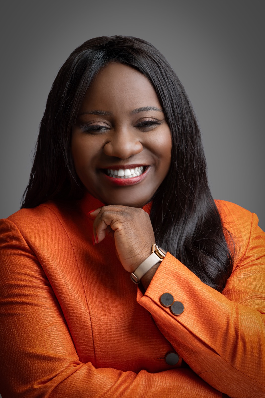 Esther Tsedey in an orange suit